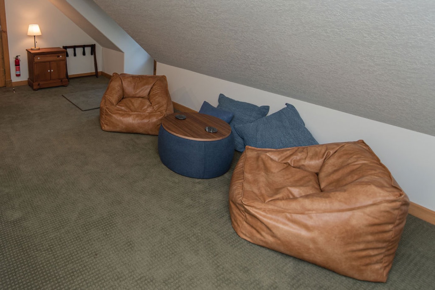 Leather bean-bag lounge seating in the game house at Camp Sunnyside.